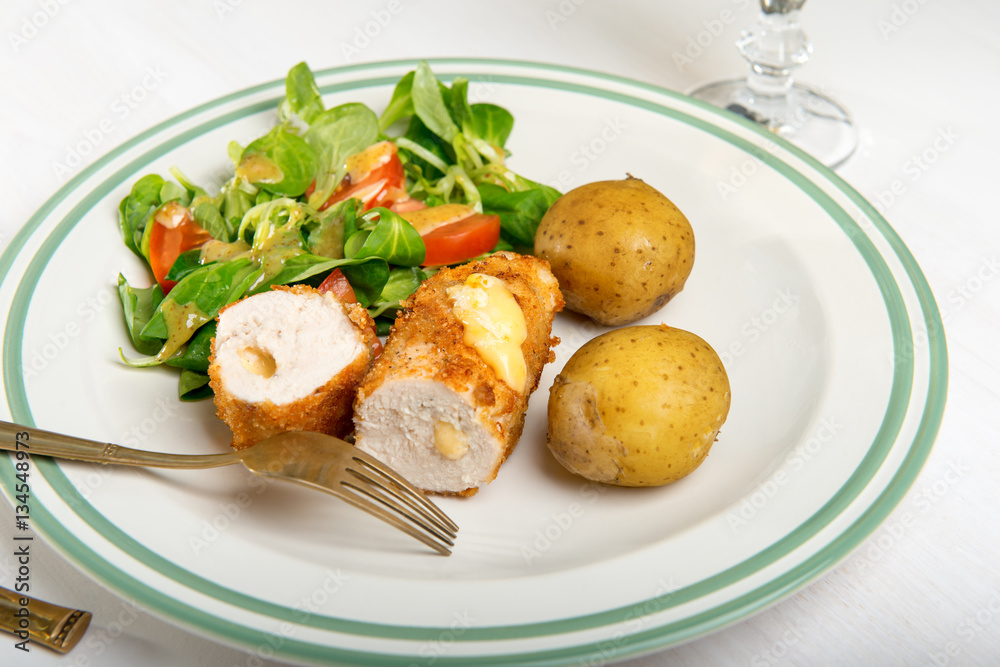 Kiev cutlet with jacket potatoes and salad Kiev cutlet with jacket potatoes and salad