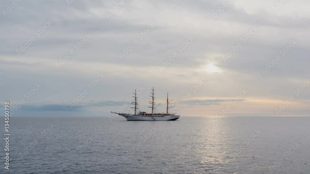 Large sailing ship on the atlantic ocean in a sunset. Timelapse
