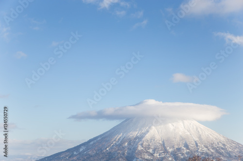 Winter landscape of lenticular cloud on the top of Mt.Yotei, the stratovolcano in Niseko Annupuri Ski Area, Hokkaido, Japan