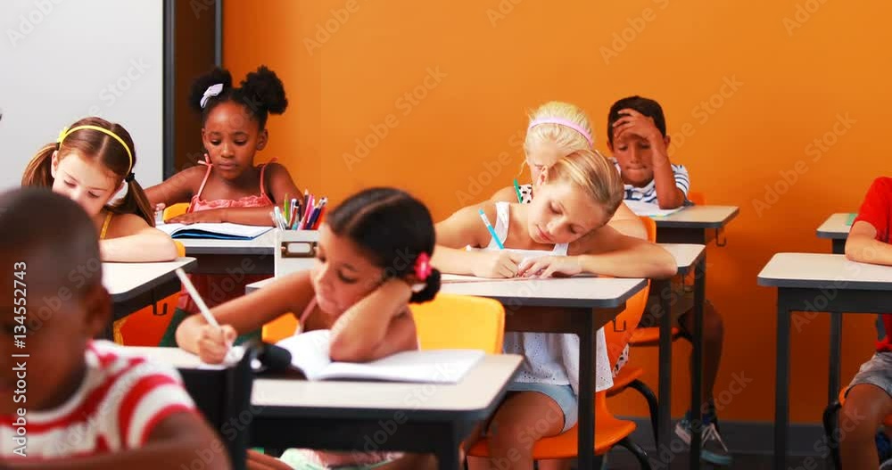 School kids doing their homework in classroom at school 4k School kids doing their homework in classroom at school 4k