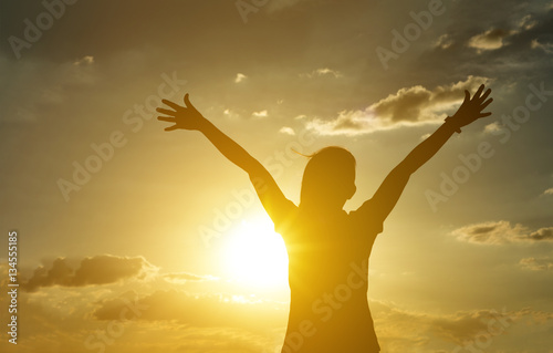 Women or female hand up on sky and clouds with sunset background