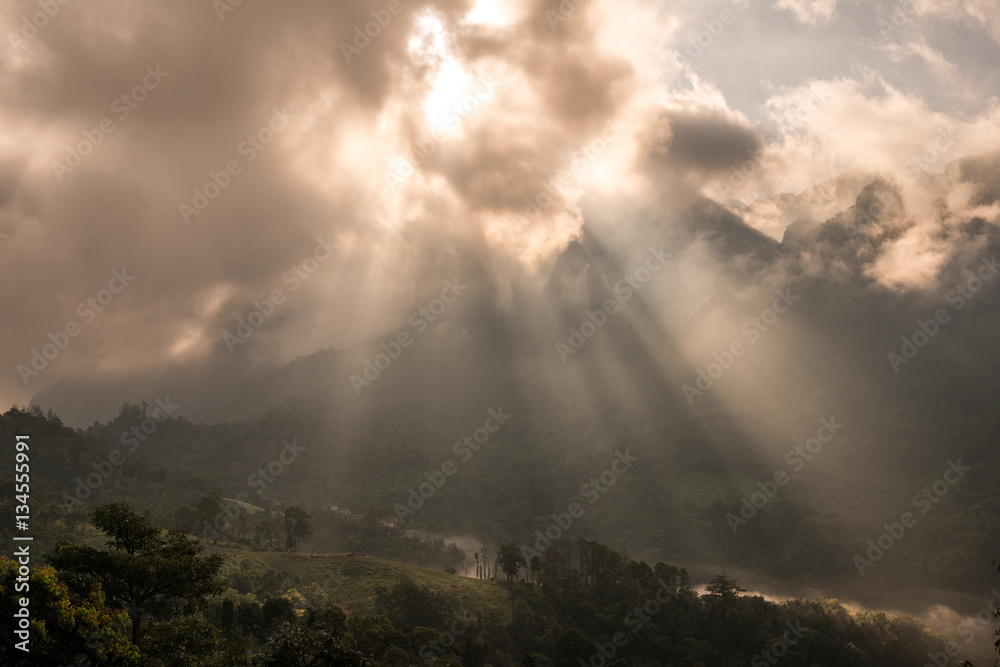 The sunbeam shining to the land in the countryside of Chiangdao mountain in Chiangmai province of Thailand.