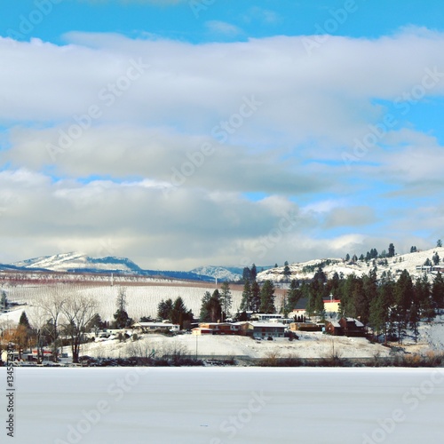 Winter lake, mountains and town