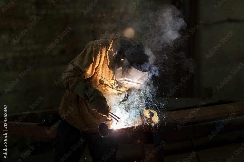 Industrial Worker at the factory welding closeup. Industrial Worker at the factory welding closeup.