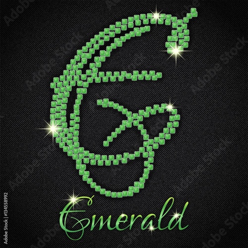 Calligraphic letter E from realistic crystals with sparkles of precious stone Emerald on black denim background. Vector illustration