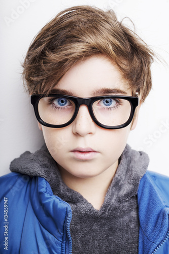 Handsome boy is wearing eyeglasses. Isolated on white background