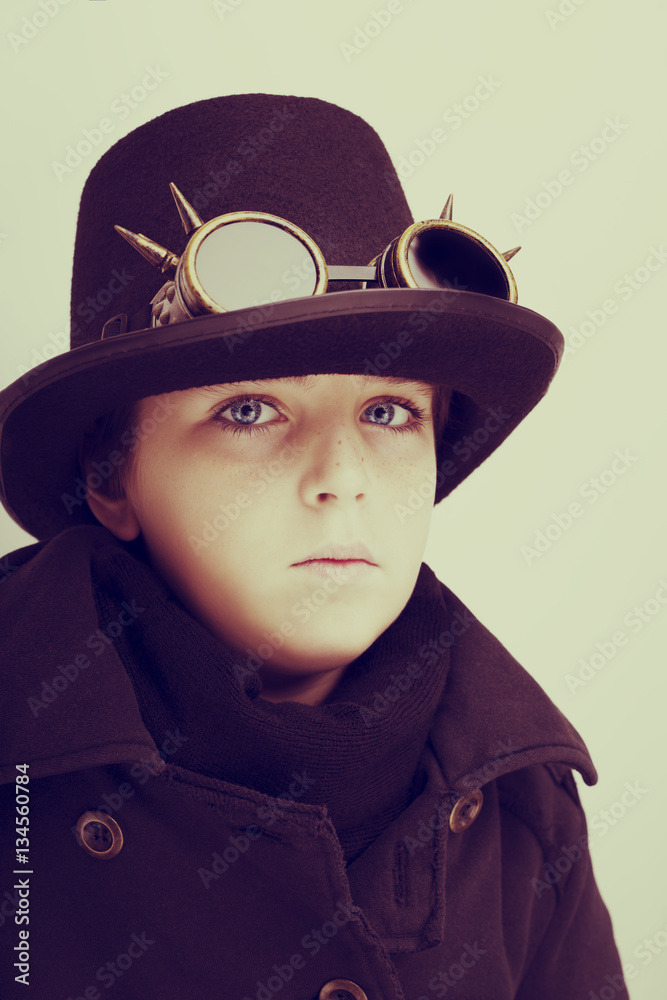 Portrait of a handsome boy closeup steampunk on white background