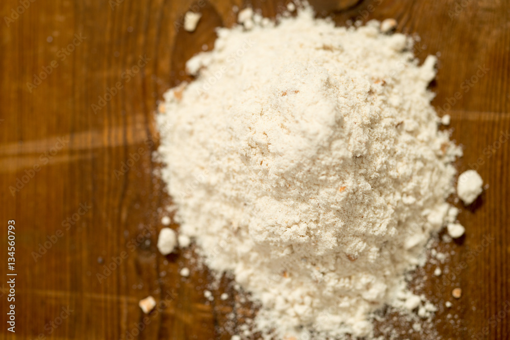 Heap of Wheat Flour on Wooden Surface