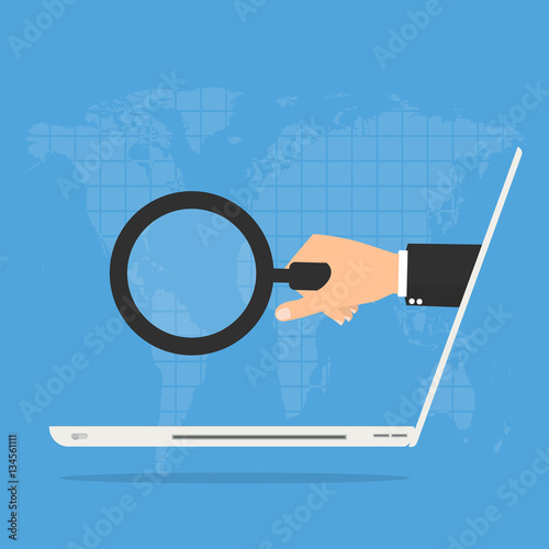 businessman hand with magnifying glass from laptop computer on world map background. Online Scam business concept.