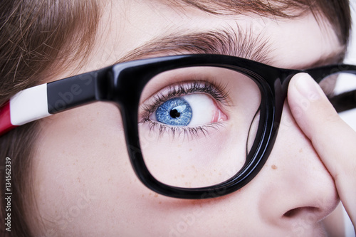 Portrait of a boy wearing glasses close