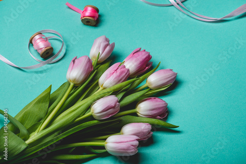 Fototapeta Naklejka Na Ścianę i Meble -  Pink tulips on blue background