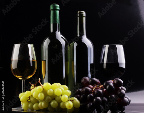 Wine glass and Bottle on black background. Red and white wine