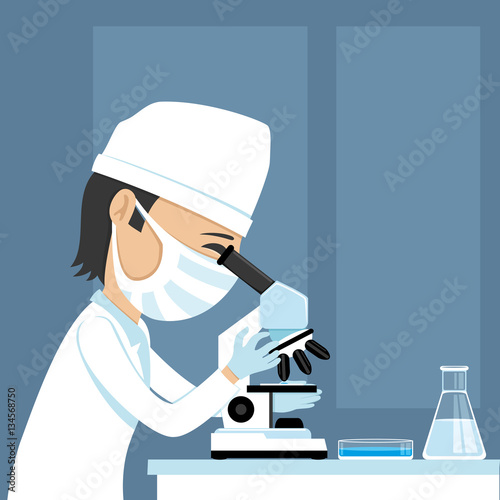 Doctor looking into a microscope.