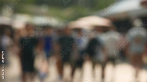 Blur background anonymous crowd of people walking on Jatujak market street of Thailand.
