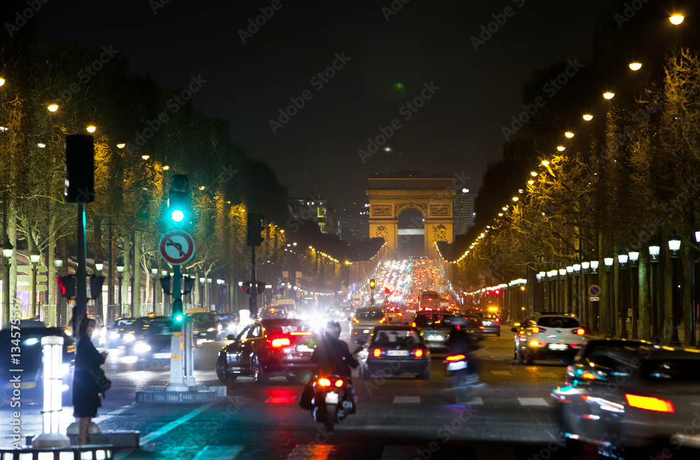 Fototapeta premium Night fires of cars on the Champs Elysee. Paris