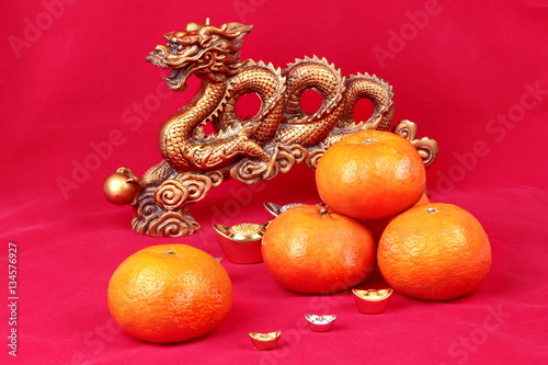 Golden orange with golden dragon and silver celebrate the blessi photo