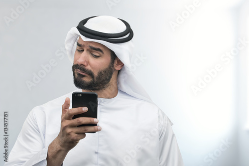 Arabian Businessman expressing disappointment on the phone.. © Ramzi