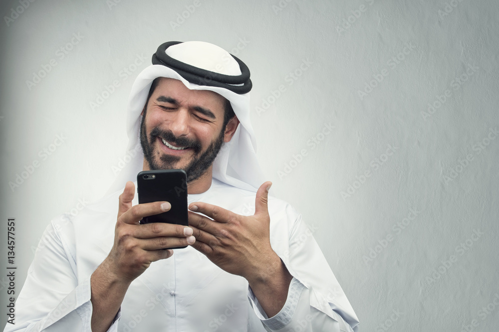Arabian Businessman smiling on the phone.. Arabian Businessman smiling on the phone..