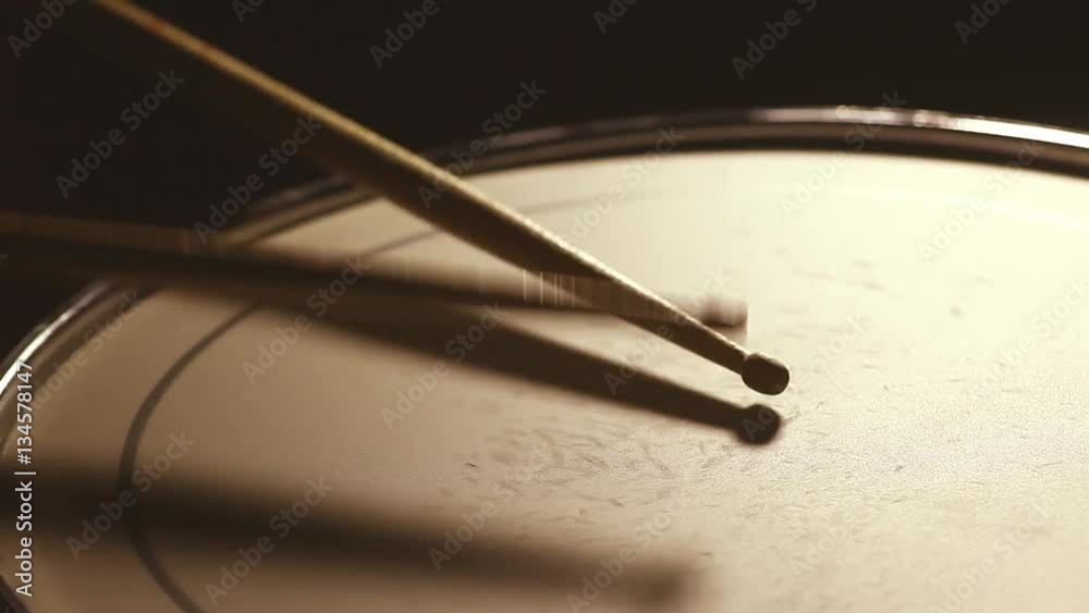 Close up footage of two drum sticks hitting a snare drum. StockVideo