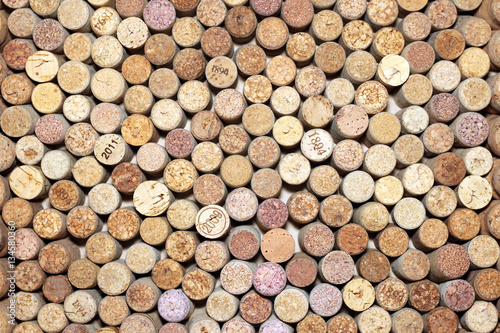 Background of used wine corks. Wall of many different wine corks. Closeup of wine corks.