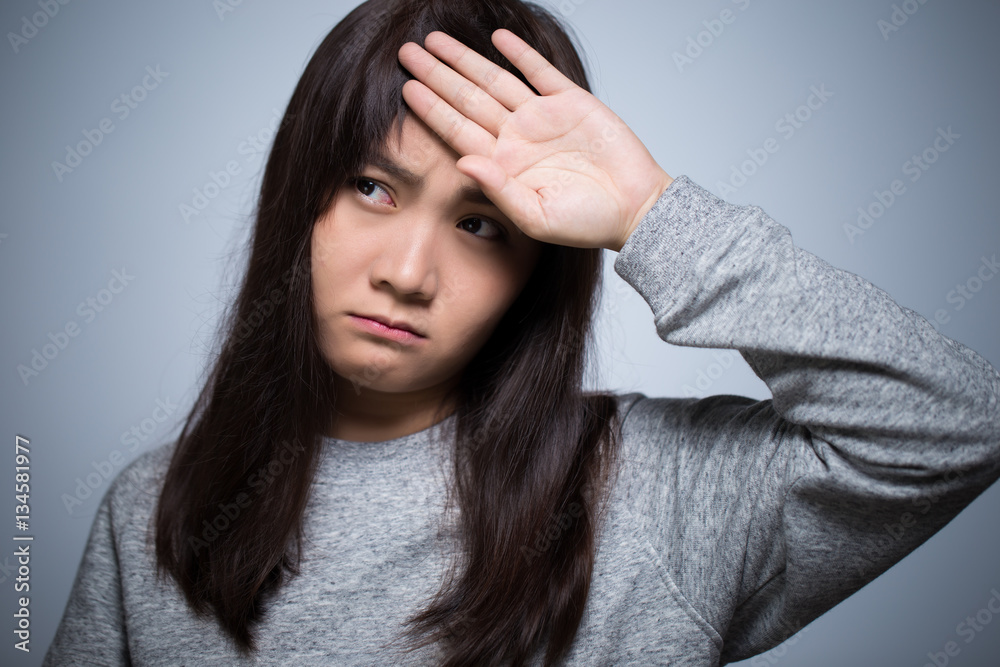 Woman has head ache on isolated background Woman has head ache on isolated background