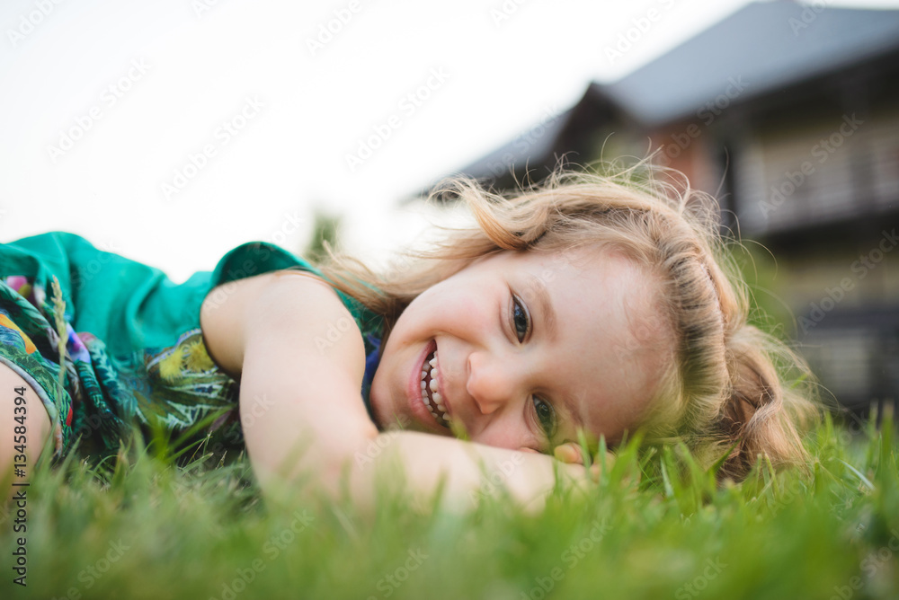 Girl Laying on Grass in Yard Girl Laying on Grass in Yard