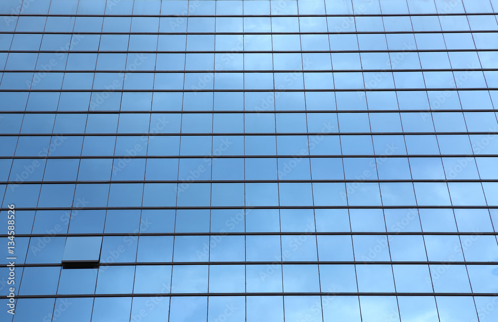 Blue sky reflected in the glass building. Blue sky reflected in the glass building.