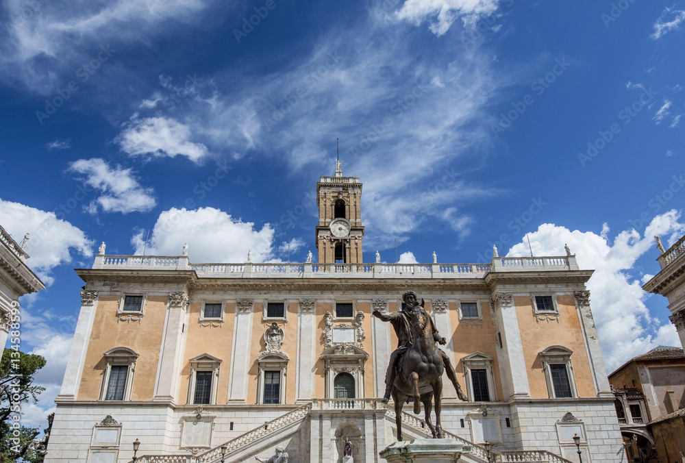 Obraz premium Capitoline Hill in Rome with emperor Marcus Aurelius ancient bronze statue and beautiful clouds