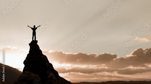 man on the top of a rock © Kotangens