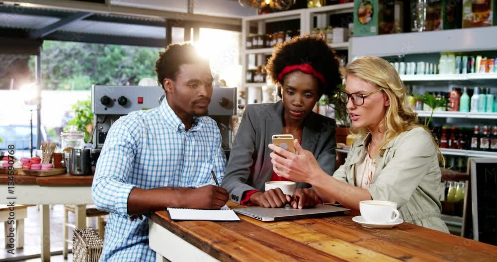 Man and woman interacting with each other while having cup of coffee in café 4k Man and woman interacting with each other while having cup of coffee in café 4k