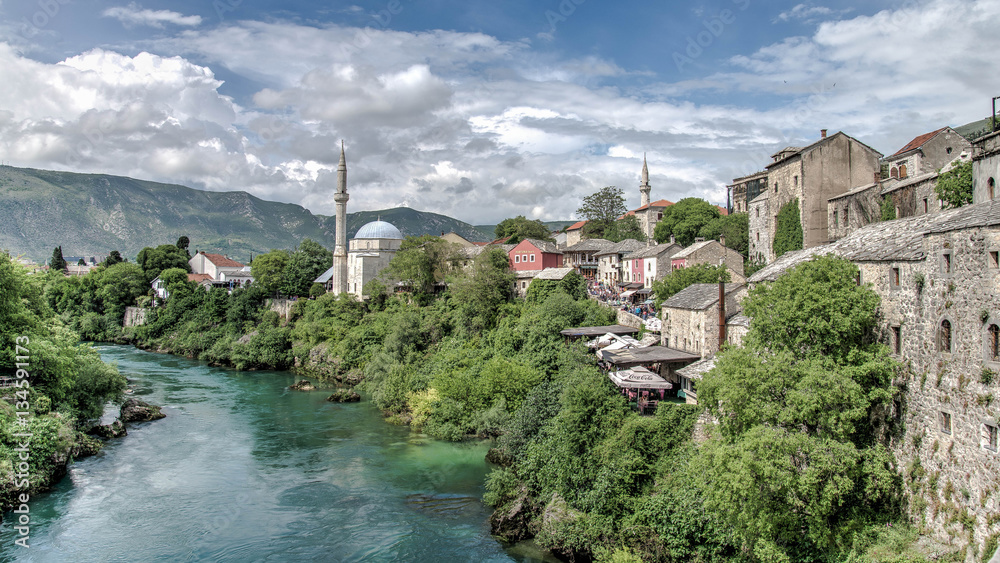 Mostar, Bosnia Herzegovina - May 1, 2014: Nerteva River and Old City of Mostar, with Ottoman Mosque