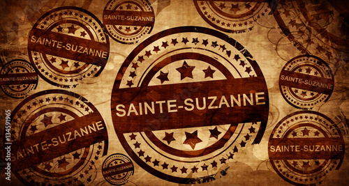 sainte-suzanne, vintage stamp on paper background