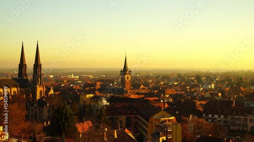 Majestic yellow sunset over the city Obernai, Alsace, France photo