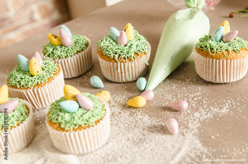 easter cupcakes on wooden background