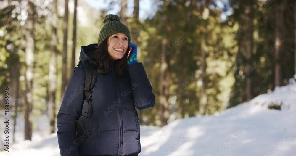 in mountains on vacation A girl uses a mobile phone or smartphone for texting,calling, take pictures, make selfies and video calls friends and family from home. Concept:holiday,technology,love,message in mountains on vacation A girl uses a mobile phone or smartphone for texting,calling, take pictures, make selfies and video calls friends and family from home. Concept:holiday,technology,love,message