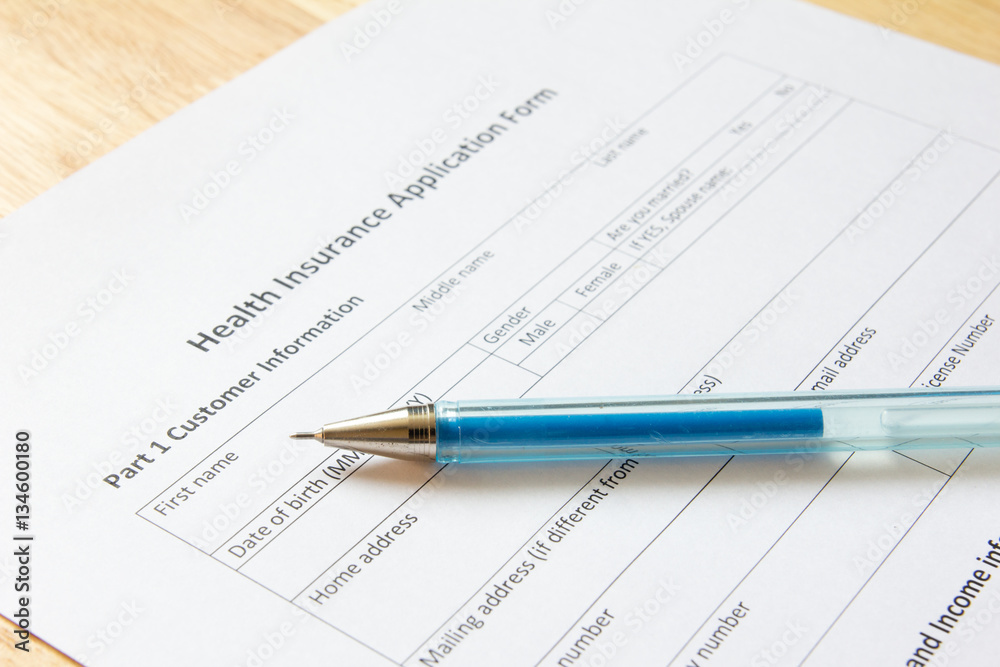 Blank health insurance application form with pen wait for fill d Blank health insurance application form with pen wait for fill d