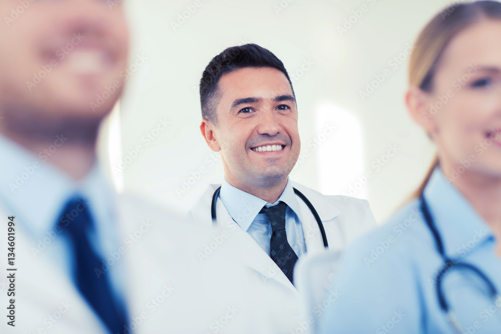 happy doctor over group of medics at hospital happy doctor over group of medics at hospital