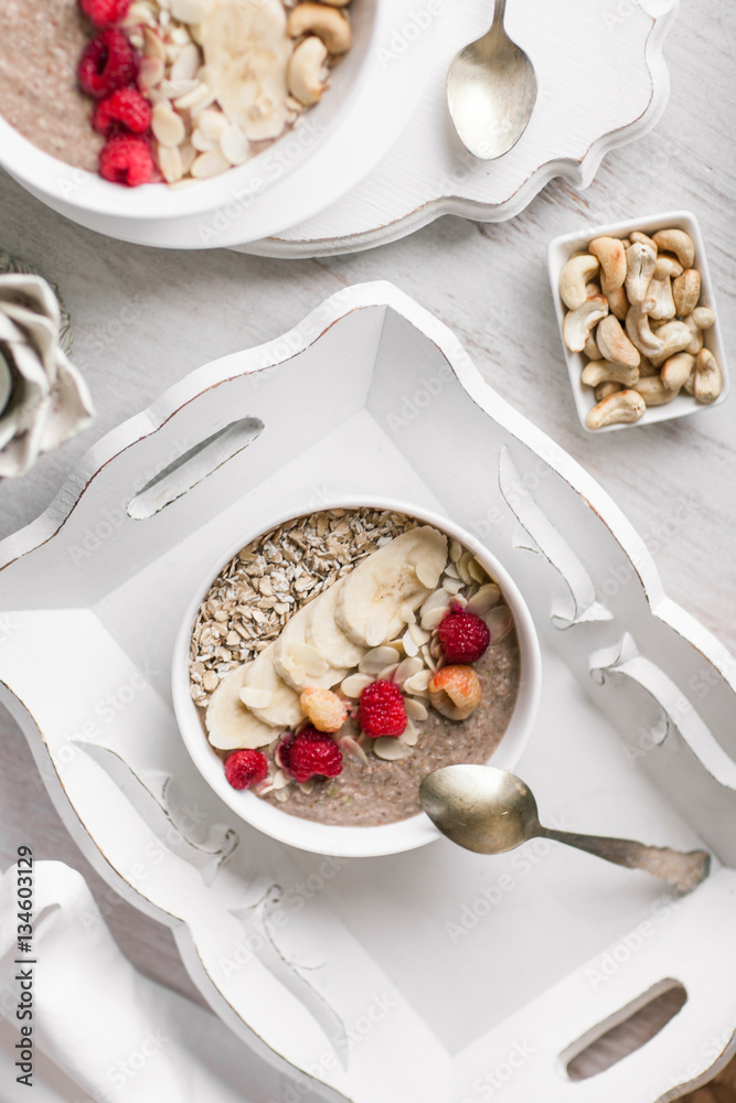 Smoothie in a bowl with fruits and seeds. Healthy breakfast. Smoothie in a bowl with fruits and seeds. Healthy breakfast.