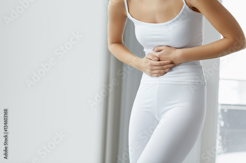 Female Pain. Closeup Beautiful Woman Body Feeling Stomach Pain