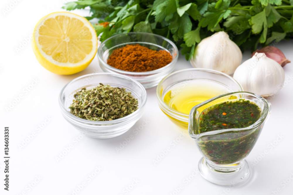 Green Chimichurri Sauce and ingredients isolated on white background
