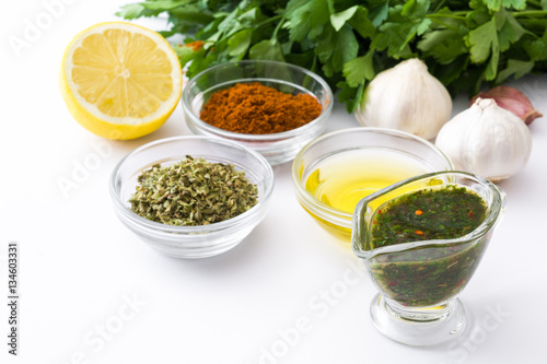 Green Chimichurri Sauce and ingredients isolated on white background 