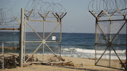 Border fence on the shore of the Sea of Japan in South Korea photo