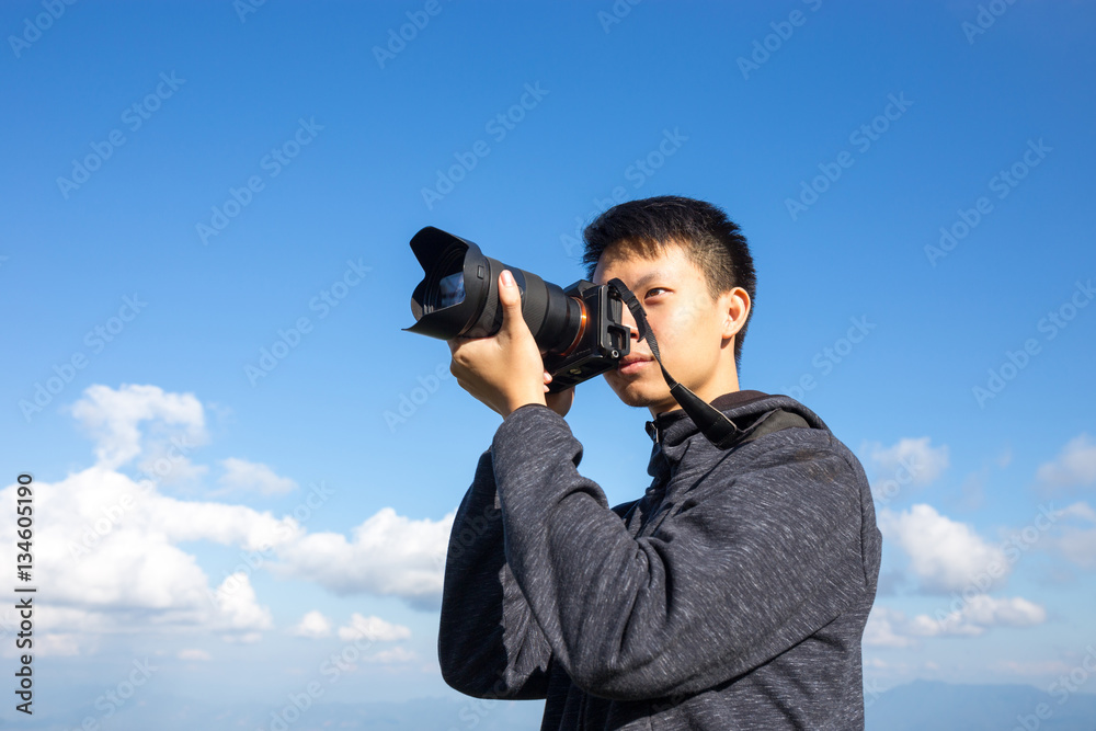 photographer is taking a picture on top of the mountain photographer is taking a picture on top of the mountain