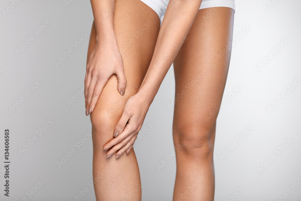 Body Pain. Close-up Of Beautiful Female Body With Pain In Knees Body Pain. Close-up Of Beautiful Female Body With Pain In Knees