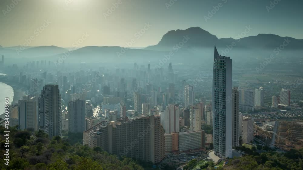 timelapse of the coast and high rise skyline of benidorm seaside resort, shot from a high vantage point, spain