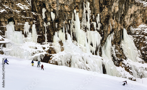 Skiers in the slopes of Armentarola, Passo Falzarego, dolomites, Italy photo