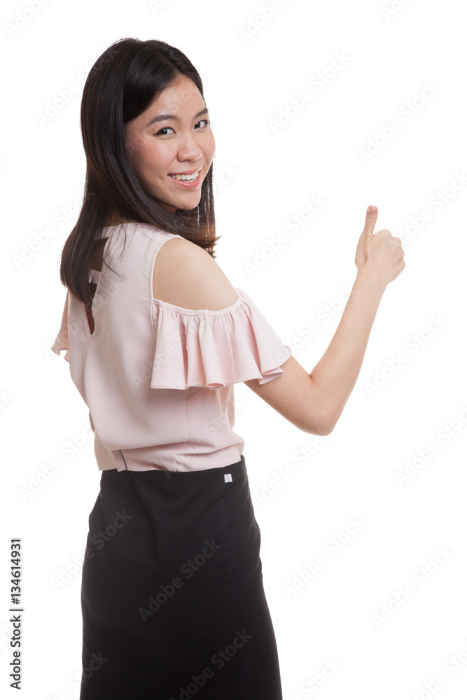Young Asian businesswoman turn back thumbs up. Young Asian businesswoman turn back thumbs up.