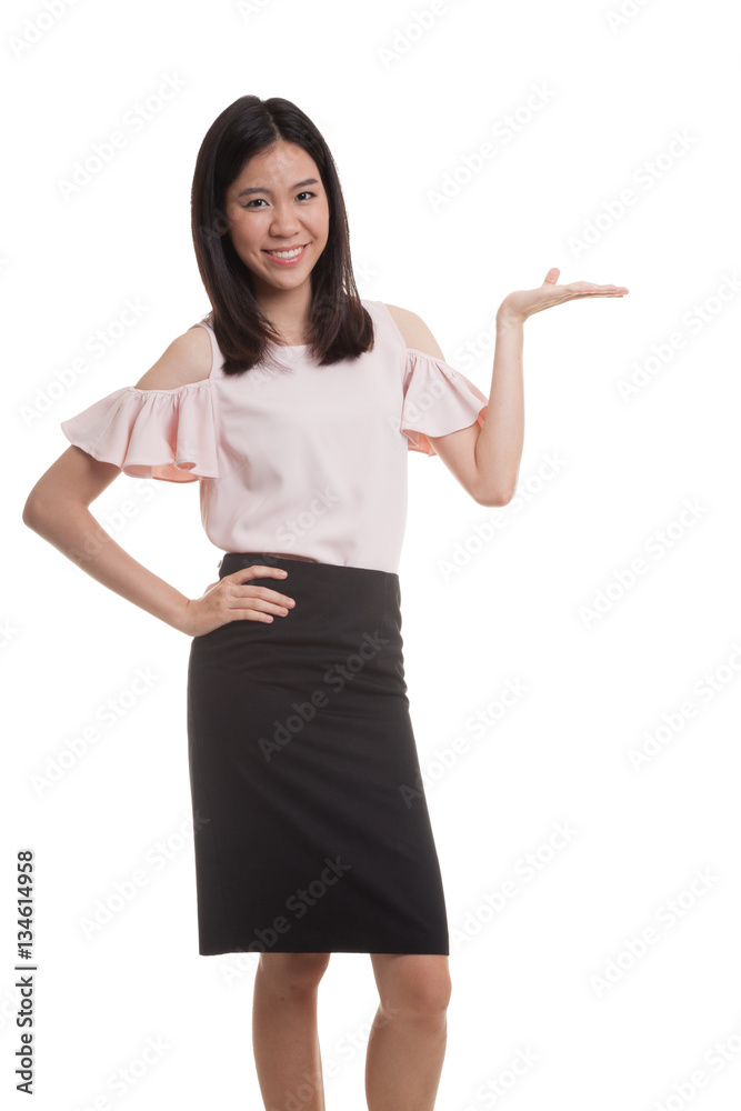 Young Asian business woman present with her hand. Young Asian business woman present with her hand.