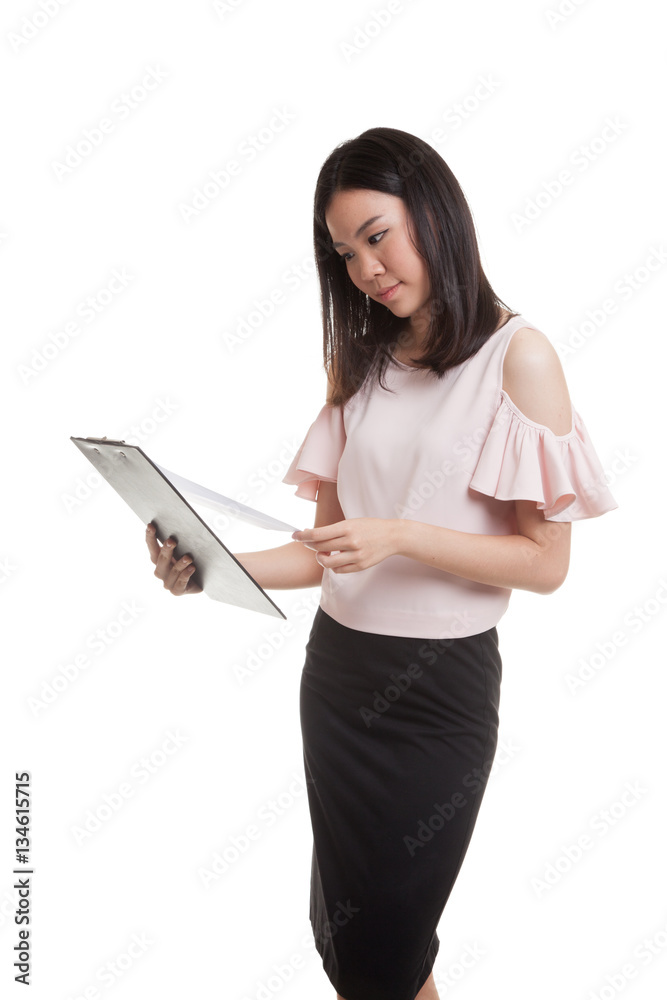 Young Asian business woman read paper on clipboard. Young Asian business woman read paper on clipboard.