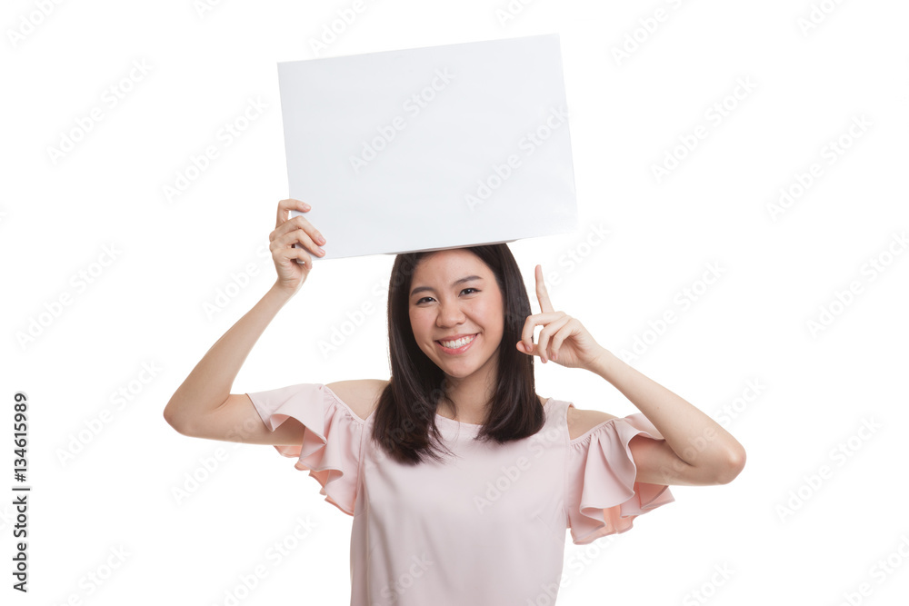 Young Asian business woman point to blank sign. Young Asian business woman point to blank sign.